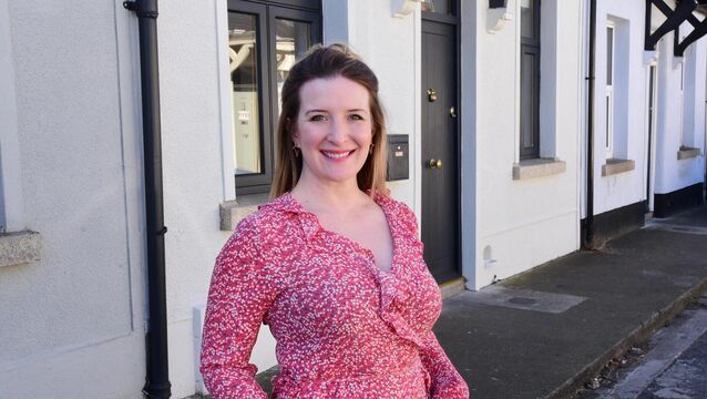 <p> Jennifer Sheahan outside her house in Rathmines, painted a neutral off-white. Picture: Moya Nolan</p>