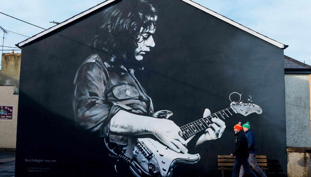 TASTE: Fans arrive for the game between Donegal and Kerry past a Rory Gallagher mural