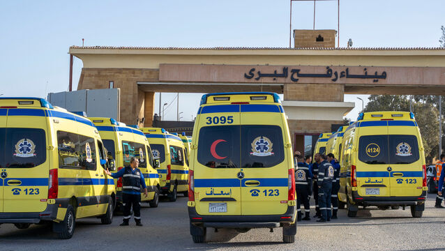 <p>Ambulances line up to enter the Egyptian gate of the Rafah crossing on the way to the Gaza Strip (Mohamed Arafat/AP)</p>