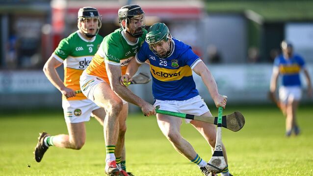 <p>Darragh Stakelum of Tipperary holds off Ben Conneely of Offaly at Glenisk O'Connor Park in Tullamore. Pic: Matt Browne/Sportsfile</p>