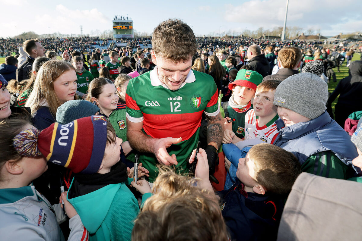 Mayo's Jordan Flynn signs autographs after the game. Pic: Mandatory Credit ©INPHO/Laszlo Geczo