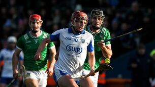 <p>Calum Lyons of Waterford races clear of Diarmaid Byrnes and Mike Casey of Limerick, left. Pic: Ray McManus/Sportsfile</p>