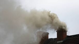 <p>Smoke from the chimney of a house fueled with coal. File Picture: iStock</p>