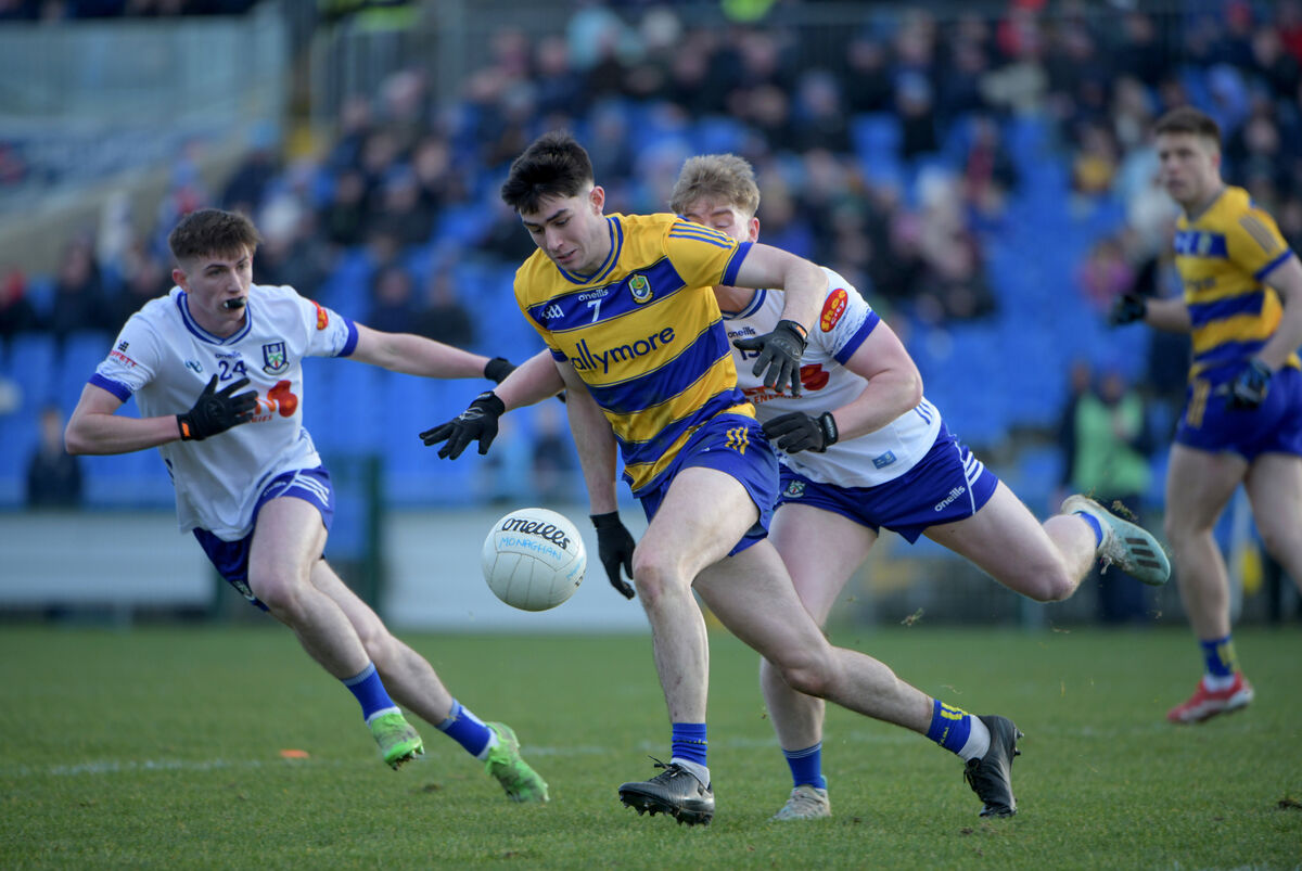 Senan Lambe of Roscommon with Oisin McGorman and Stephen Mooney of Monaghan