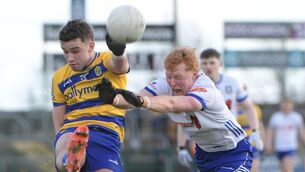 <p>Roscommon midfielder, Conor Ryan, gets a shot away towards goal under pressure from Monaghan's Ryan O'Toole during Sunday afternoon's Division One Football League game at King and Moffatt Dr. Hyde Park. Picture: INPHO/Andrew Paton</p>