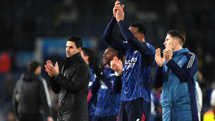 <p>Arsenal manager Mikel Arteta (left) and players applauds the fans following victory in the Premier League match at Elland Road.</p>