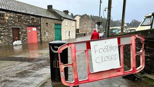 <p>The flooded quays in Graiguenamanagh on the River Barrow. The town in County Kilkenny has seen flooding after the River Barrow burst its banks in the heavy rainfall following Storm Chandra. Picture: Eamonn Farrell/RollingNews.ie</p>