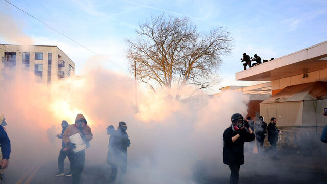 Federal agents deployed tear gas, pepper balls and rubber bullets, witnesses said (Allison Barr/The Oregonian via AP)