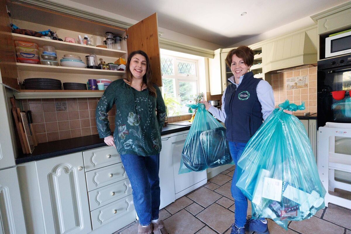 Jess Casey and Anne Marie with some of bags Anne Marie is taking away.