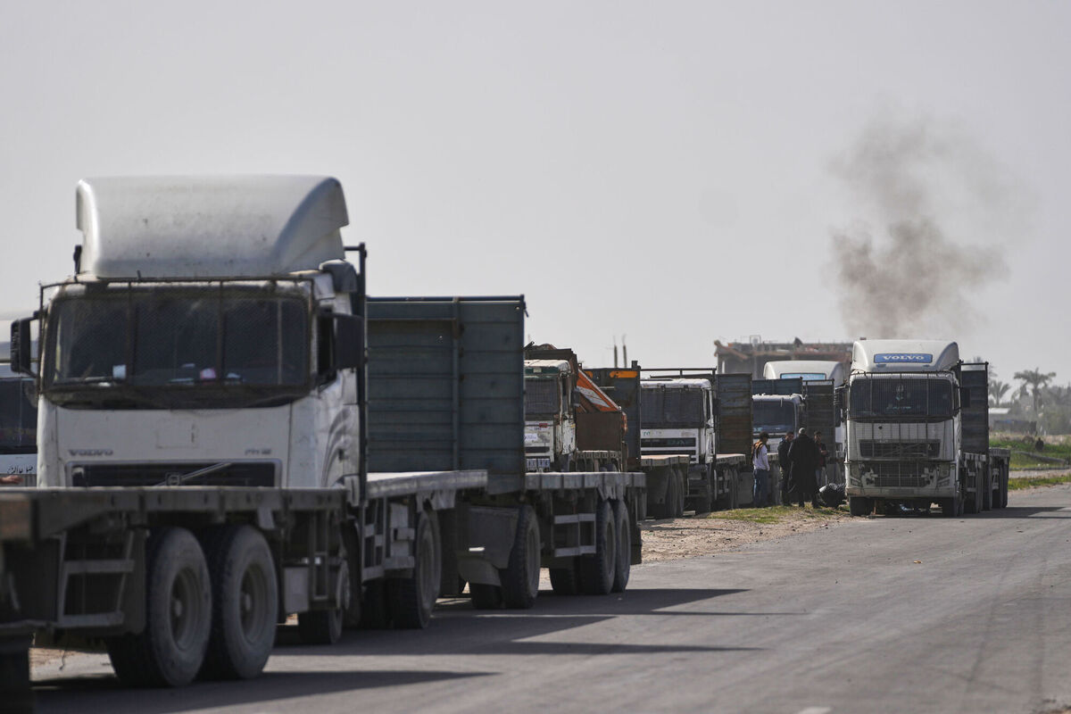 Palestinian commercial trucks are seen parked in an area in Deir al-Balah near the Kissufim crossing as they wait for permission to receive a cargo of goods for sale in the Gaza Strip, Tuesday, Jan. 27, 2026. Picture: AP Photo/Abdel Kareem Hana