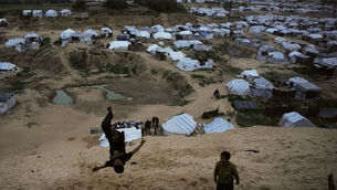 <p>Children practice parkour on a sand dune near tents housing displaced Palestinians in Deir al-Balah, central Gaza Strip, Sunday, Feb. 1, 2026. Pictire: AP Photo/Abdel Kareem Hana</p> <p>Children practice parkour on a sand dune near tents housing displaced Palestinians in Deir al-Balah, central Gaza Strip, Sunday, Feb. 1, 2026. Pictire: AP Photo/Abdel Kareem Hana</p>