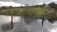 Farm Gates submerged in a Flooded area after Rainstorm