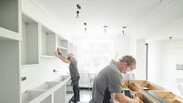 joinery team fitting a kitchen