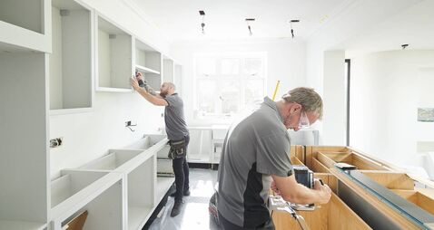 joinery team fitting a kitchen