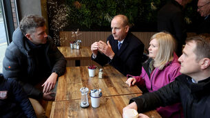 <p>Taoiseach Micheál Martin meets Conor Swaine, left, owner of coffee shop BTwenty7 in Enniscorthy, during his visit to the town. Pictures: Liam McBurney/PA Wire</p>