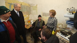 <p>Taoiseach Micheál Martin meets Maryellen McNamara (right) and John McNamara (centre) whose home was damaged in the recent flooding. Picture: Liam McBurney/PA Wire</p>