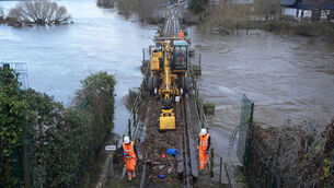 <p>Irish Rail workers clear debri from the line in Enniscorthy Co Wexford after Storm Chandra. Picture: Niall Carson/PA Wire</p>