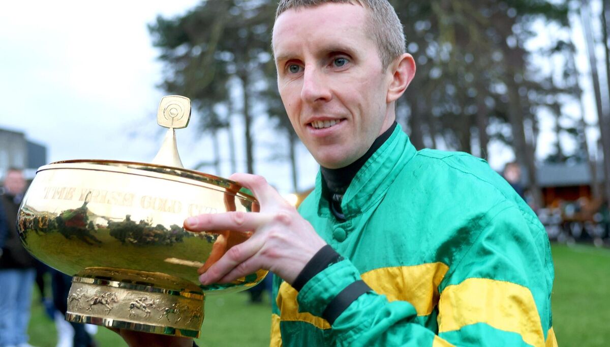 Jockey Mark Walsh celebrates with the Paddy Power Irish Gold Cup after victory on Fact To File during day two of the Dublin Racing Festival at Leopardstown Racecourse in Dublin. Pic: Thomas Doolin/Sportsfile