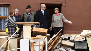 <p>Taoiseach Micheal Martin meets Sarah (right) Thompson, Helena Cartcart (second from left), John McNamara and Maryellen McNamara who were affected by the recent flooding during a visit to on Island Road in County Wexford. Picture: Liam McBurney/PA Wire</p>