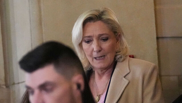 <p>Far-right leader Marine Le Pen leaves the courtroom during her appeal trial after an embezzlement conviction, Tuesday, Jan. 13, 2026 in Paris. (AP Photo/Christophe Ena)</p>