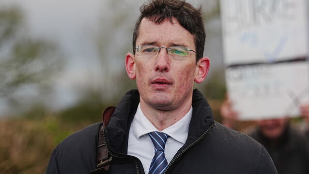 <p>Enoch Burke outside Wilson’s Hospital School in Co Westmeath having been refused entry (PA)</p>