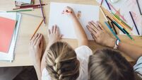 Homeschooling: Hands of an Unrecognizable Child Drawing While Sitting on her Mother's Lap, Lockdown Activities Concept (Overhead