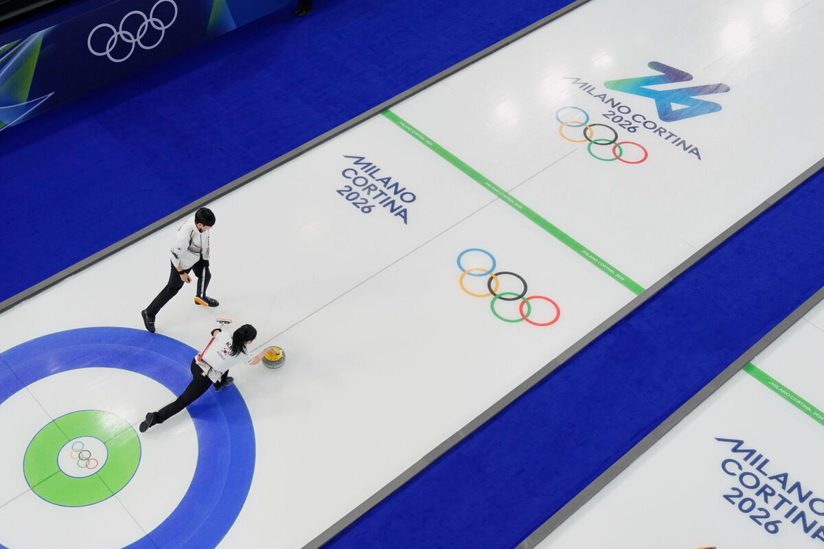 South Korea's Jeong Yeong-seok and Kim Seon-yeong compete during a curling mixed doubles session at the 2026 Winter Olympics in Cortina d'Ampezzo. Pic: David J Phillip/AP
