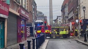 <p>Emergency personnel at the scene after a bus crashed into a building on Talbot Street in Dublin city centre. Picture: Bairbre Holmes/PA Wire</p>