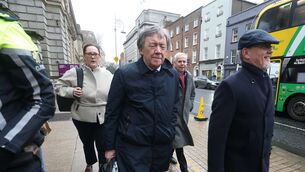 <p>Bord Bia chair Larry Murrin walks past protesting farmers outside Leinster House ahead of his appearance before the Oireachtas Agriculture Committee today.</p>