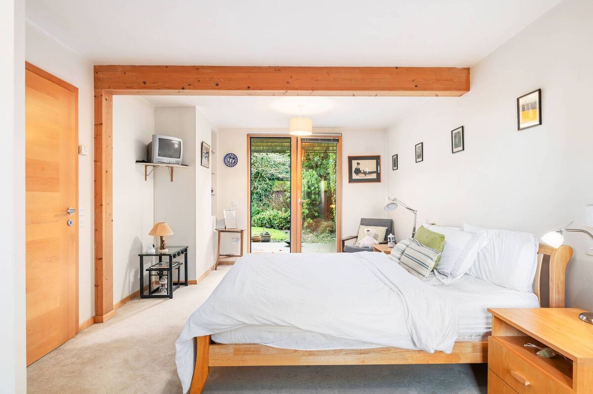 Downstairs bedroom with double doors to deck Downstairs bedroom with double doors to deck