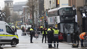 <p>Garda forensic collision investigators at the scene of the bus crash on North Earl St in Dublin city centre on Thursday. Picture: Sam Boal/Collins</p>