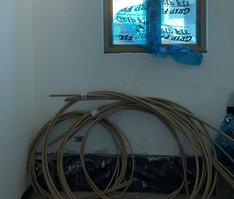 Plan for later: lay pipes for underfloor heating now, and install the manifold in the next phase.