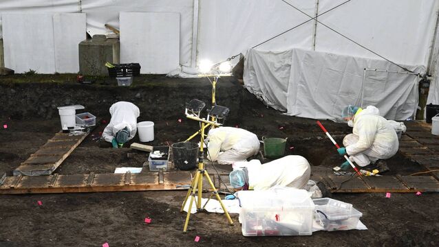 <p>ODAIT forensic staff working under the temporary tent at the site of the former Mother and Baby Institution in Tuam, Co Galway. Picture: ODAIT</p>