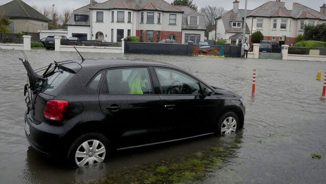 <p>Met Éireann said heavy rainfall on already saturated ground, combined with high river levels and high tides, could lead to flooding and disruption throughout the day. Flooding on Clontarf Road in Dublin yesterday. Picture: Brian Lawless/PA Wire</p>