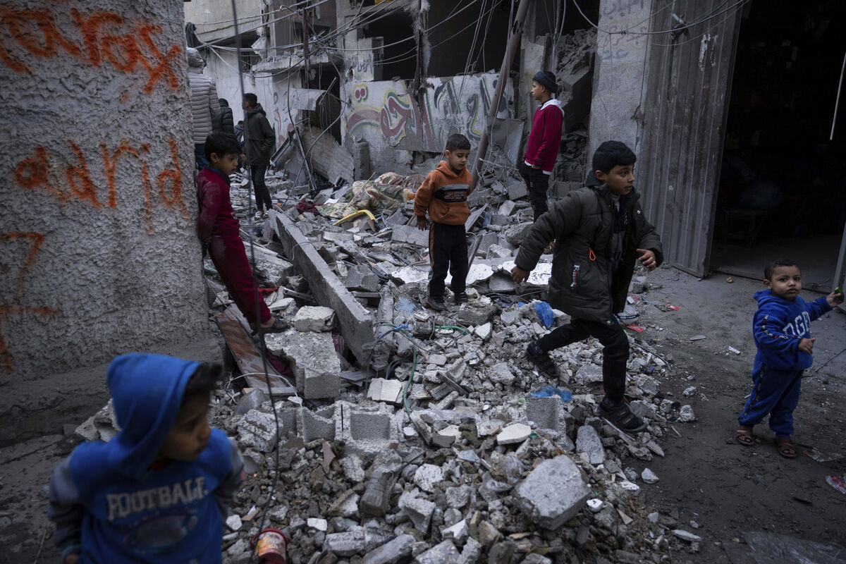 Palestinians look at the destruction after an Israeli strike in Rafah, southern Gaza Strip. Picture: Fatima Shbair/AP