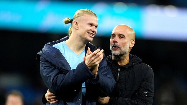 <p>Pep Guardiola (right) believes Erling Haaland is the best striker in the world (Martin Rickett/PA)</p>
