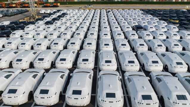 <p>Electric vehicles bound for shipment at a port in China. Bloomberg</p>