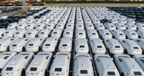 Electric vehicles bound for shipment at a port in China