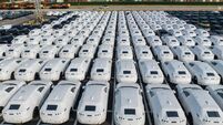 Electric vehicles bound for shipment at a port in China