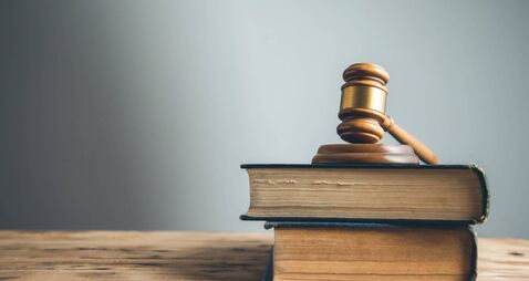 wooden judge on book on the desk