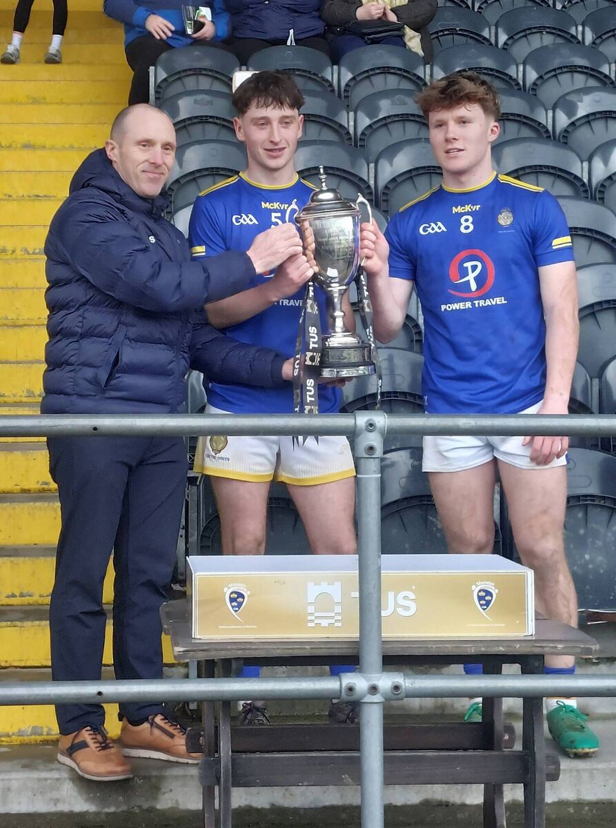 Corn Uì Mhuirí presentation to Tralee CBS jt. captains, Fionan Ryan and Mairtin McKivergan by Deagláin Mac Gearailt, chairman Munster PPS. Pic: Adrienne McLoughlin
