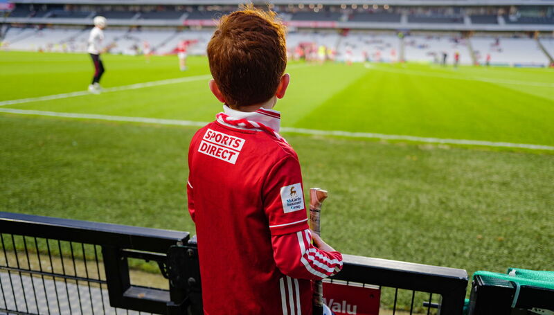 Cillian Downey, seven years old, from Cloughduv, watches the Cork players warm up before challenge game in advance of the Allianz Hurling League Division 1A match between Cork and Tipperary at SuperValu Páirc Ui Chaoimh in Cork. Photo by Ray McManus/Sportsfile