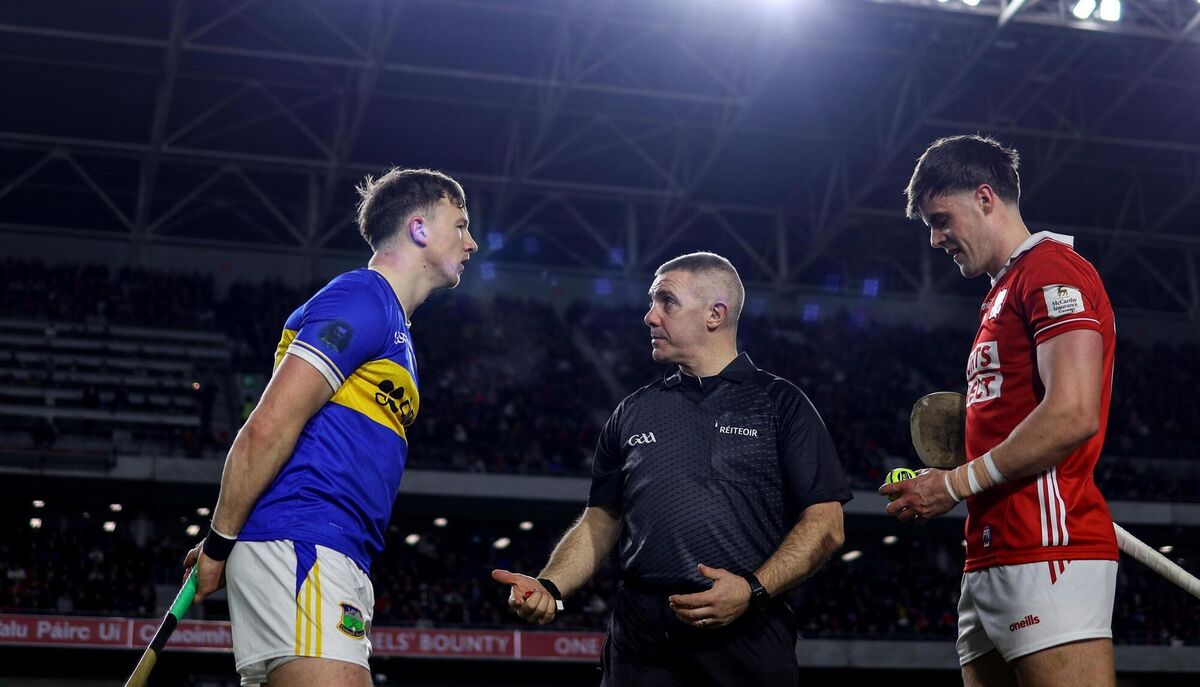 Tipperary's Jake Morris with Referee Liam Gordon and Cork's Darragh Fitzgibbon at the coin toss Mandatory Credit ©INPHO/Ben Brady