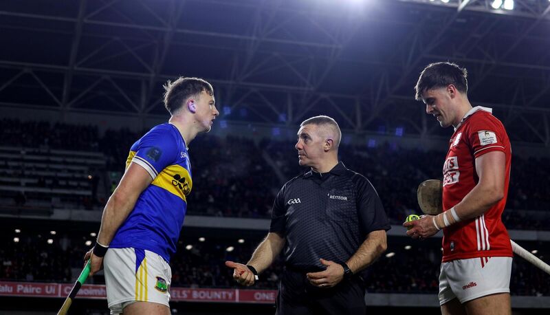 Tipperary's Jake Morris with Referee Liam Gordon and Cork's Darragh Fitzgibbon at the coin toss Mandatory Credit ©INPHO/Ben Brady