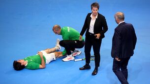 <p>Ireland's Peter Buldorini goes down with a cramp. Pic: ©INPHO/Dan Clohessy</p>