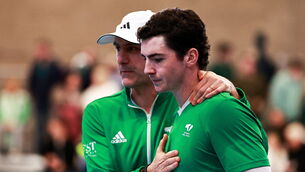 <p>Charlie Barry of Ireland with team captain Conor Niland after his and Conor Gannon's Davis Cup doubles defeat to Taym Alazmeh and Hazem Naw at UL Arena in Limerick. Pic: Thomas Flinkow/Sportsfile</p>