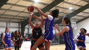 <p> Grainne Dwyer, Fr. Mathews competes with Mazatkan Harris and Niamh Tolan, Cavan Eagles in the Women's Super League clash at the Fr. Mathews Arena, Cork. Picture: Jim Coughlan.</p>