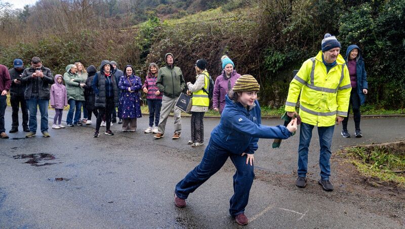 Jennifer Gobnait Ní Choinnide powers a bowl down Coolea Rd during the Gobnait-only road bowling event. Picture: Chani Anderson