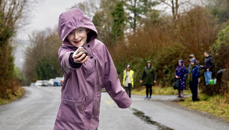 The youngest competitor and honorary Gobnait, Abbey May Ní Laoise, gets into full swing as she sends her bowl down the road. Picture: Chani Anderson
