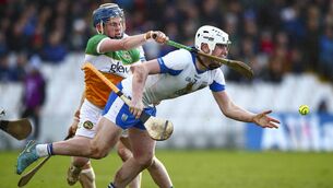 <p>Waterford's Shane Bennett gets his handpass away as he tries to avoid the challenge of Offaly's Colin Spain during their Allianz National Hurling League Division 1A clash at Azzurri Walsh Park. Photos: INPHO</p>